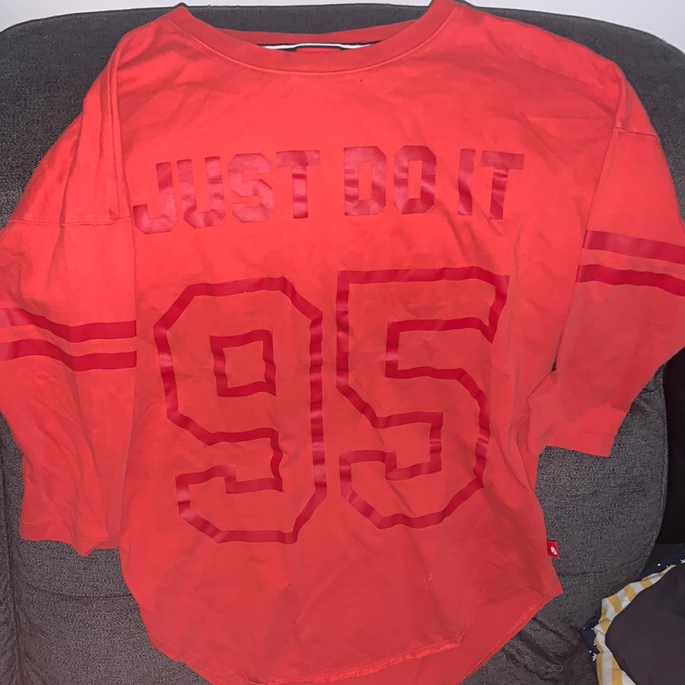 orange nike shirt
